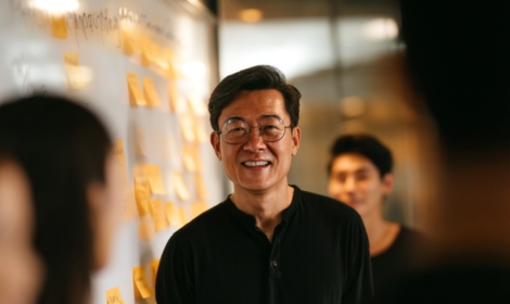 man smiling with sun reflection